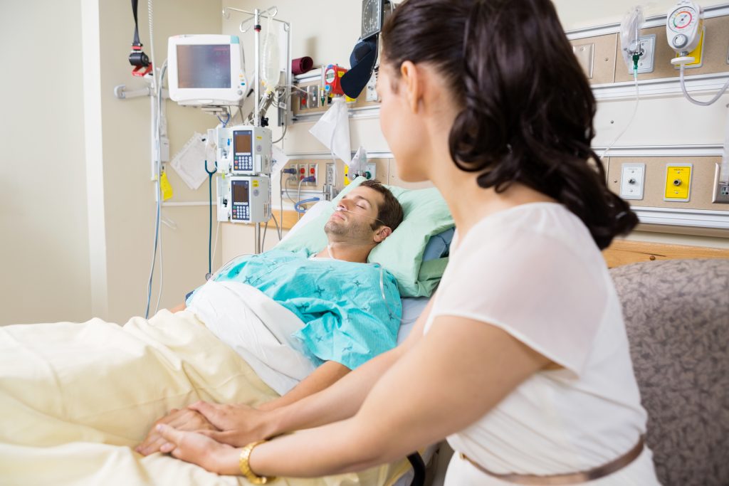 Woman Holding Man's Hand Lying On Bed Woman Holding Man's Hand Lying On Bed